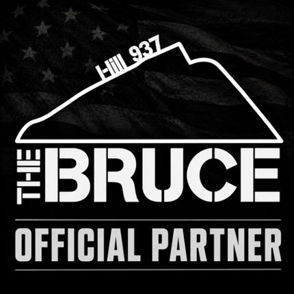 Official partner graphic for The Bruce WOD: white Hill 937 peak outline and bold text THE BRUCE OFFICIAL PARTNER set against a dark American flag.