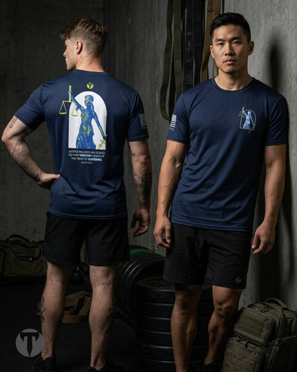 Two male models wearing Titan 6 Endure T-shirt in the Lady Justice design in a gym setting, showing the front and back views. The back of the shirt features a large graphic of the Lady Justice holding a scale of justice.