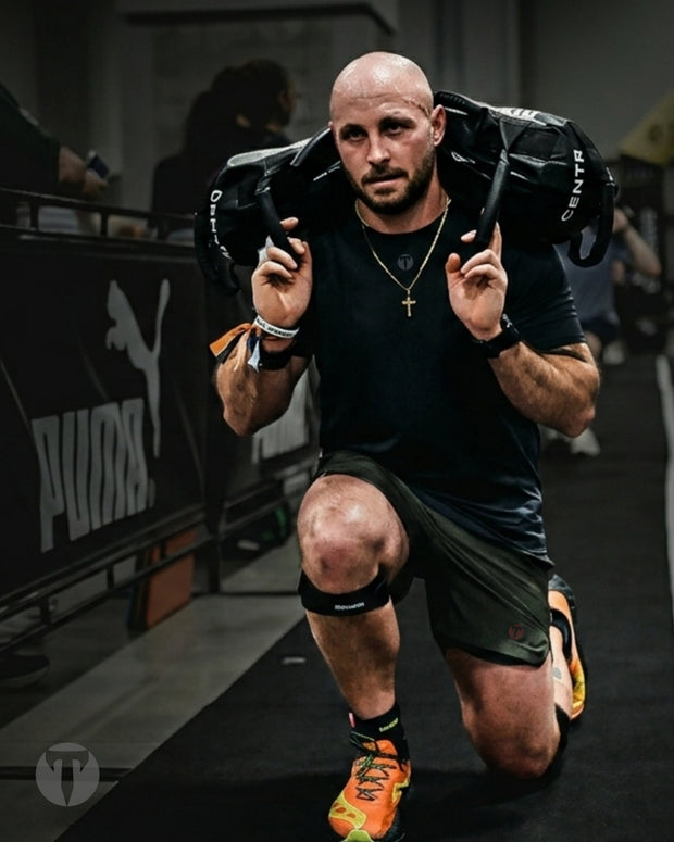 Titan 6 Athlete Zack Wisnowski in a black Strike Raglan T-shirt with the understated Titan Icon design at the HYROX NYC in 2026.