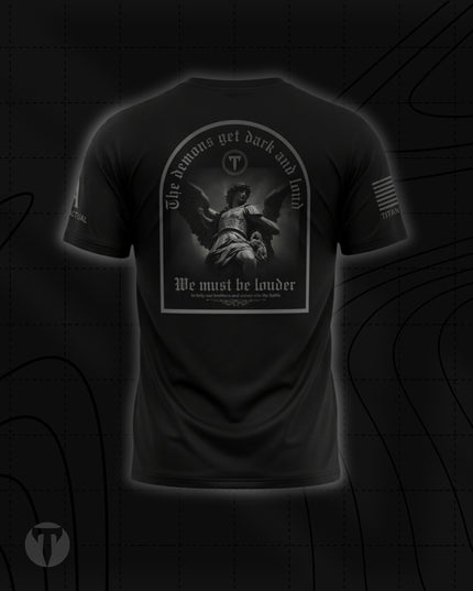 Back view of the Titan 6 Men's Endure T-Shirt in black, featuring an arched graphic of an angel statue with the text "The demons get dark and loud," "We must be louder," and "to help our brothers and sisters win the battle."