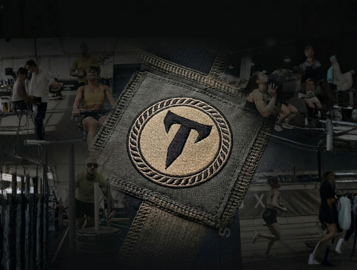 A close-up of a tactical embroidered Titan 6 logo patch set against a dark background overlaying a collage of athletes training in a gym.