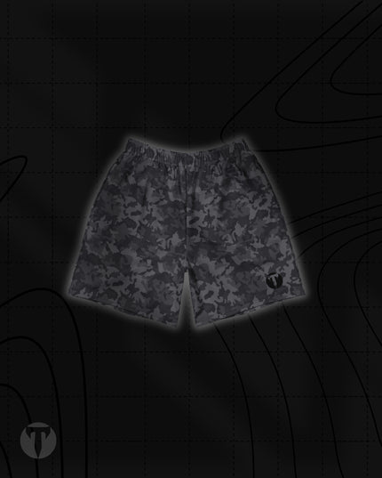 Front view of the Titan 6 Unisex Endure 6-Inch Linerless Shorts featuring a dark grey Twilight Camo pattern with the dark Icon logo printed on the left leg hem.