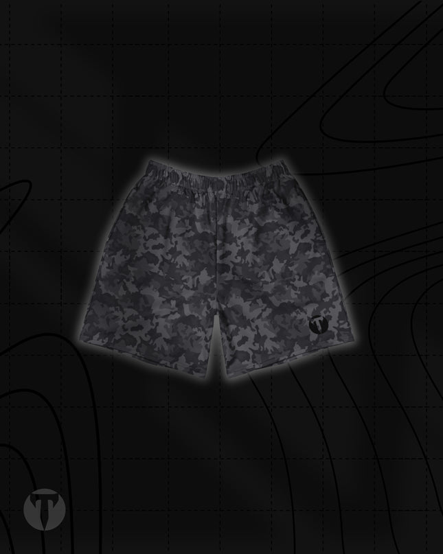 Front view of the Titan 6 Unisex Endure 6-Inch Linerless Shorts featuring a dark grey Twilight Camo pattern with the dark Icon logo printed on the left leg hem.