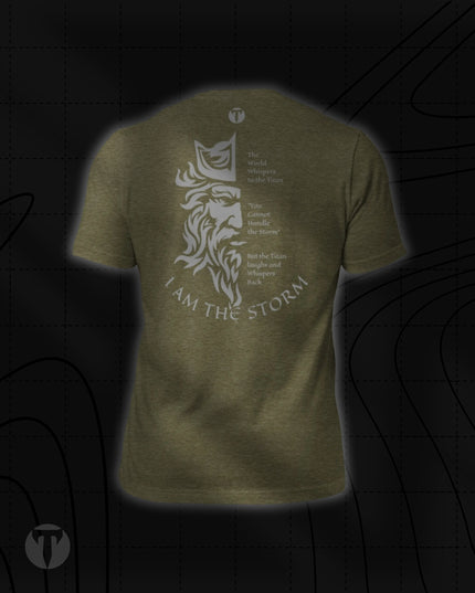 Back view of the Titan 6 Unisex Nomad Tee in Heather Olive, featuring a Zeus face graphic and the quote "I AM THE STORM" printed across the back.