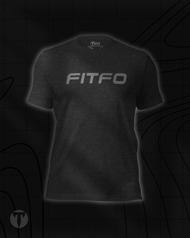 Titan 6 Unisex Nomad Tee in Dark Grey Heather, featuring "FITFO" printed across the chest in bold, silver italicized lettering.