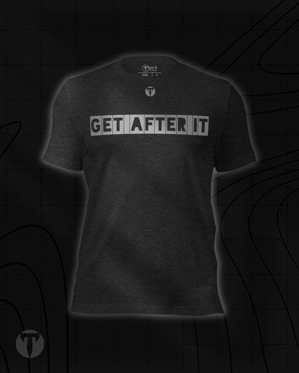 Titan 6 Unisex Nomad Tee in Dark Grey Heather, featuring "GET AFTER IT" printed across the chest in bold block letters, with a small "T" logo centered above it.