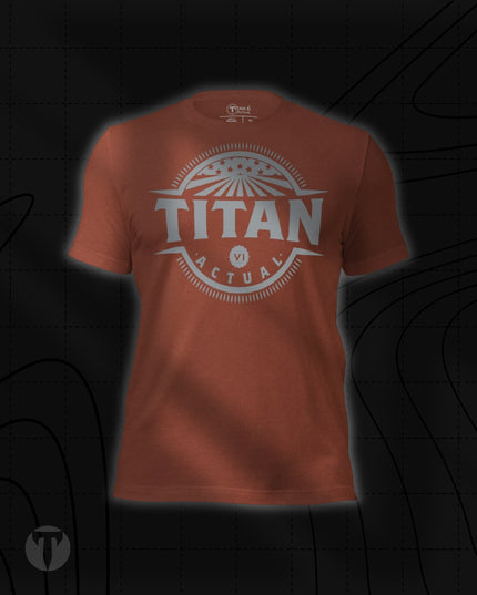 Titan 6 Unisex Nomad Tee in Heather Clay, featuring a retro circular "TITAN ACTUAL" emblem centered on the chest with stars and rays design.