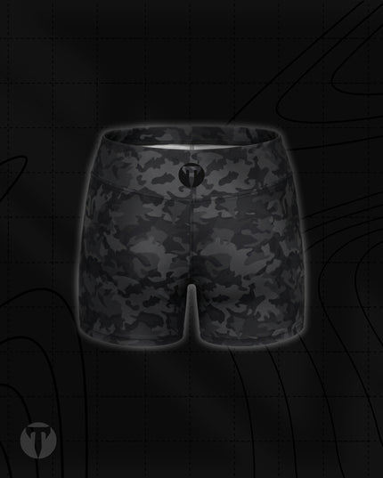 Titan 6 Women's Glide Shorts in Twilight Camo, featuring a black and dark grey camouflage pattern with a black circular "T" logo on the back waist band.