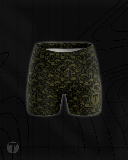Titan 6 Women's Glide Shorts in Golgotha, featuring an all-over olive drab green and black skull pattern with a circular "T" logo on the lower left leg.