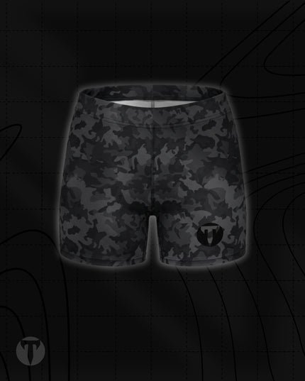 Titan 6 Women's Glide Shorts in Twilight Camo, featuring a black and dark grey camouflage pattern with a black circular "T" logo on the lower left leg.