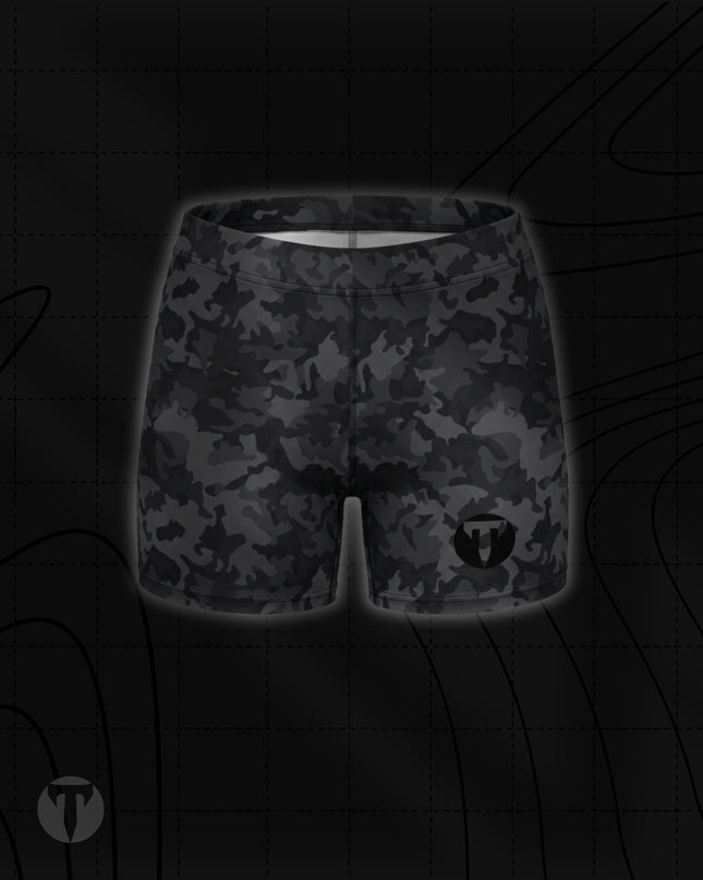 Titan 6 Women's Glide Shorts in Twilight Camo, featuring a black and dark grey camouflage pattern with a black circular "T" logo on the lower left leg.