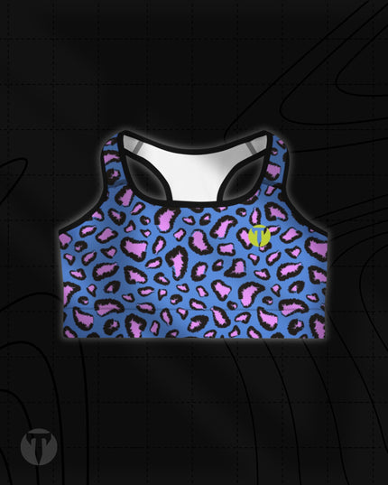 Titan 6 Women's Glide Sports Bra in Electric Leopard, featuring a vibrant royal blue and pink leopard animal print with a yellow "T" logo on the left chest.