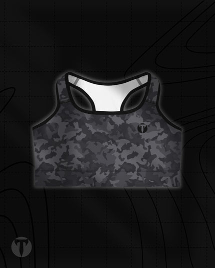 Titan 6 Women's Glide Sports Bra in Twilight Camo pattern, featuring a black and dark grey camouflage print with a small black circular "T" logo on the left chest.