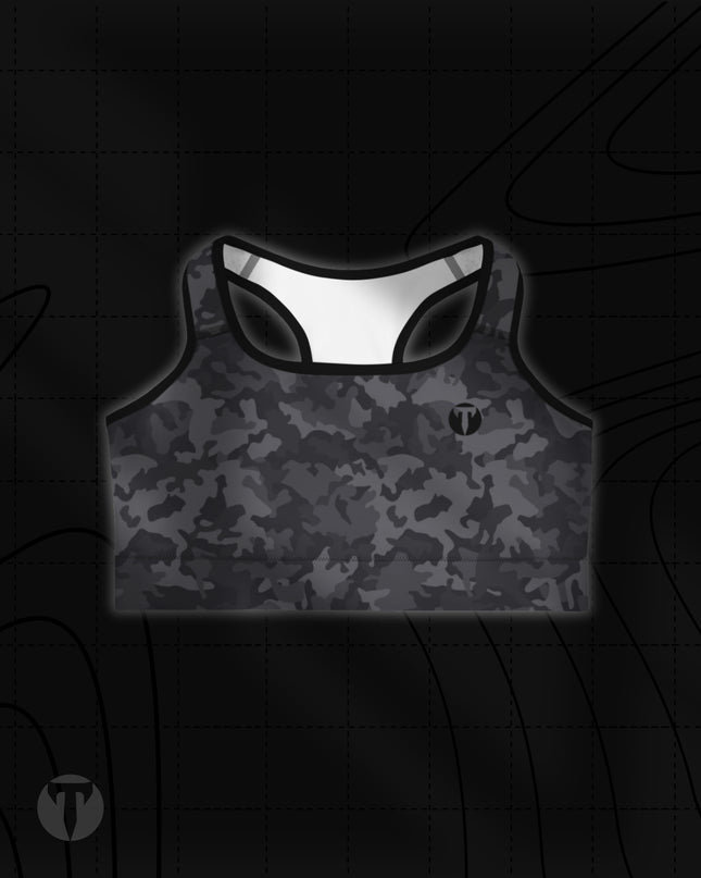 Titan 6 Women's Glide Sports Bra in Twilight Camo pattern, featuring a black and dark grey camouflage print with a small black circular "T" logo on the left chest.